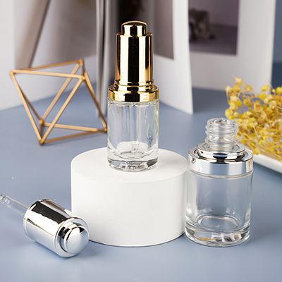 Flacon compte-goutte transparent à bouton poussoir