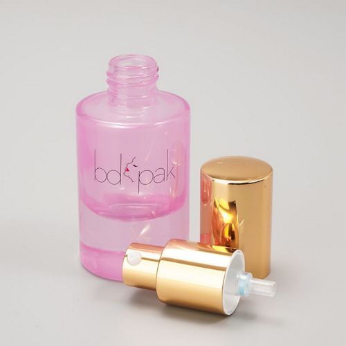 Flacon en verre rose avec bouchon doré