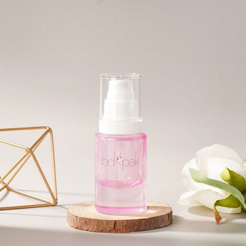 Flacon en verre rose avec bouchon transparent