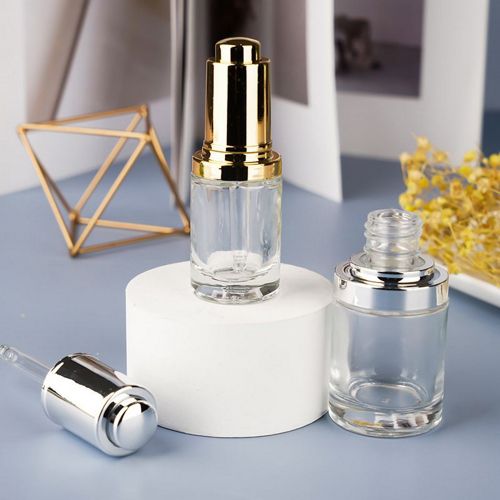 Flacon compte-goutte transparent à bouton poussoir