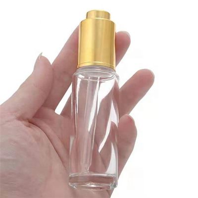 Flacon compte-goutte transparent à bouton poussoir