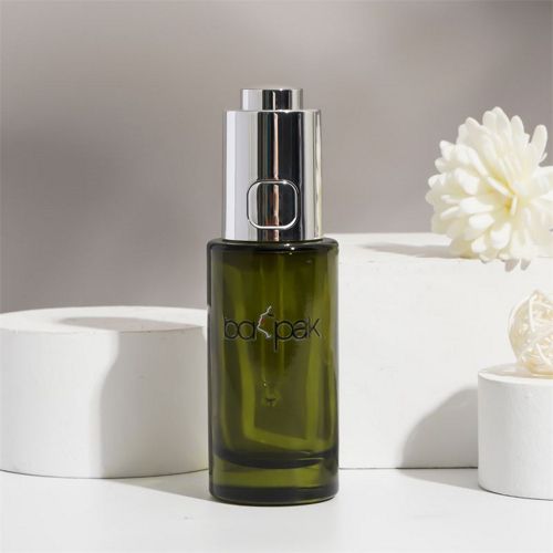 Flacon compte-goutte à bouton poussoir